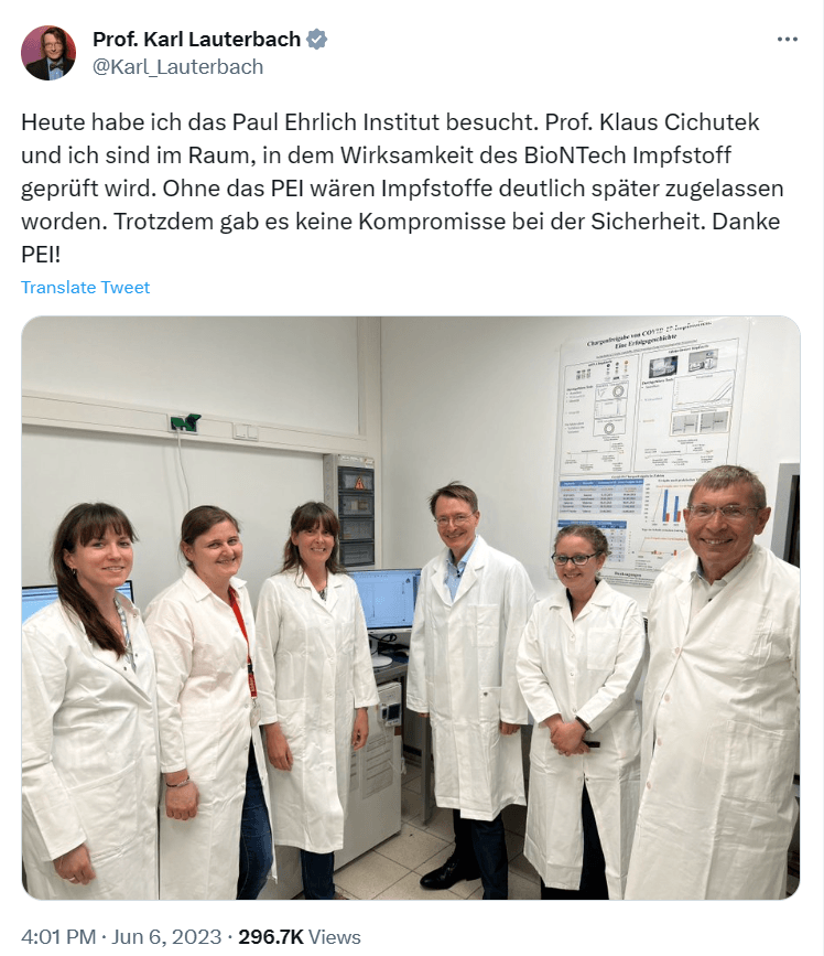 A group of people wearing white coats
Description automatically generated
